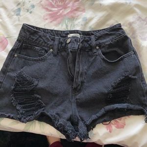 Distressed black denim cut off shorts